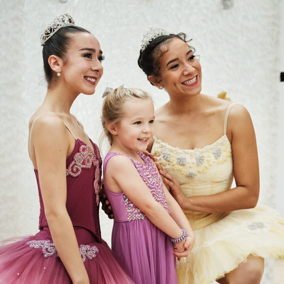 Little girl with two ballet dancers