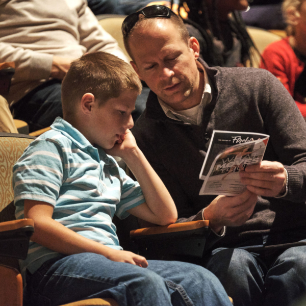 Father and his son at the ballet